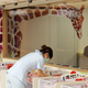 A nurse tends to a baby in the nursery at Gem Care.